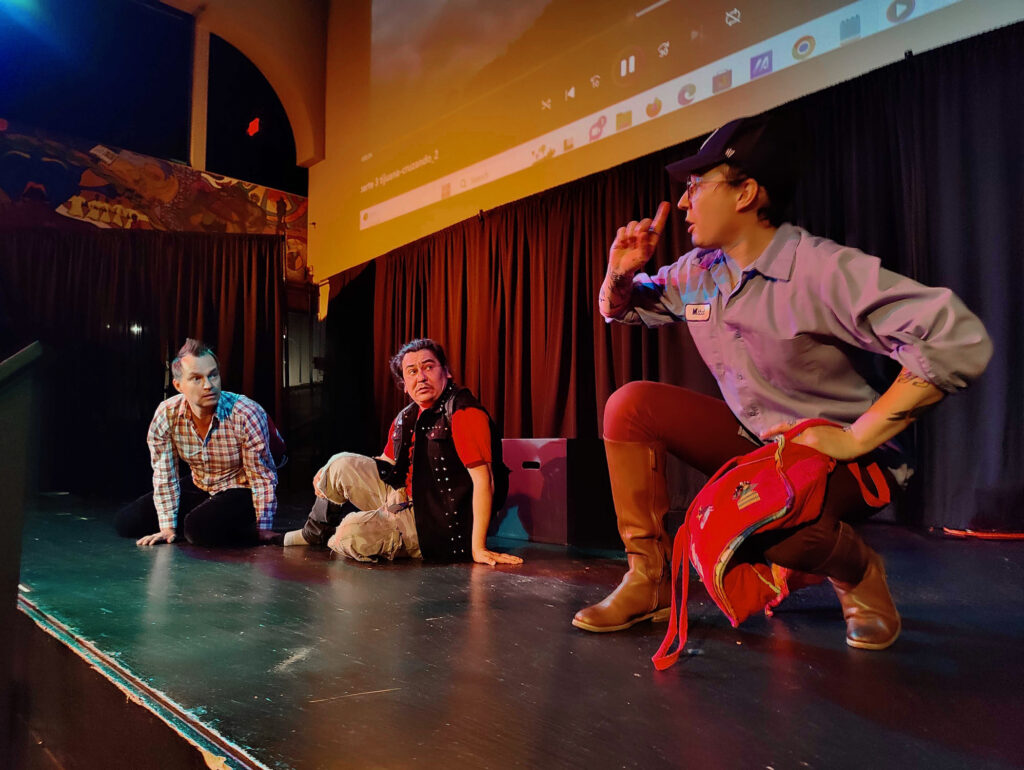 Dance troupe members rehearse onstage.