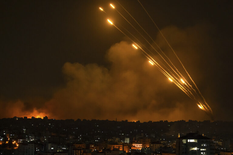 Rockets are fired toward Israel from the Gaza Strip, Sunday, Oct. 8, 2023