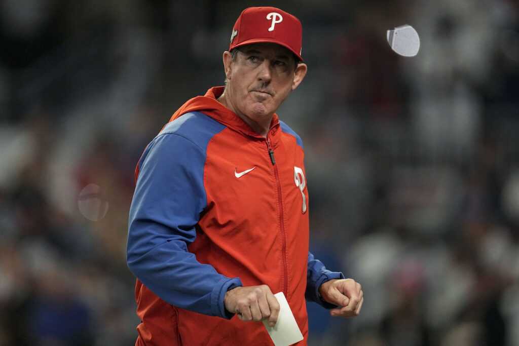 NLDS Philles Braves Baseball Philadelphia Phillies manager Rob Thomson walks back to the dugout after making a pitching change in the seventh inning of Game 2 of a baseball NL Division Series against the Atlanta Braves, Monday, Oct. 9, 2023, in Atlanta. (AP Photo/John Bazemore)