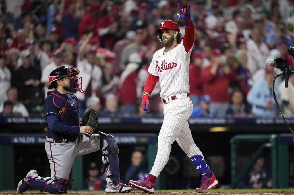 NLDS Braves Phillies Baseball Philadelphia Phillies' Bryce Harper reacts after hitting a home run
