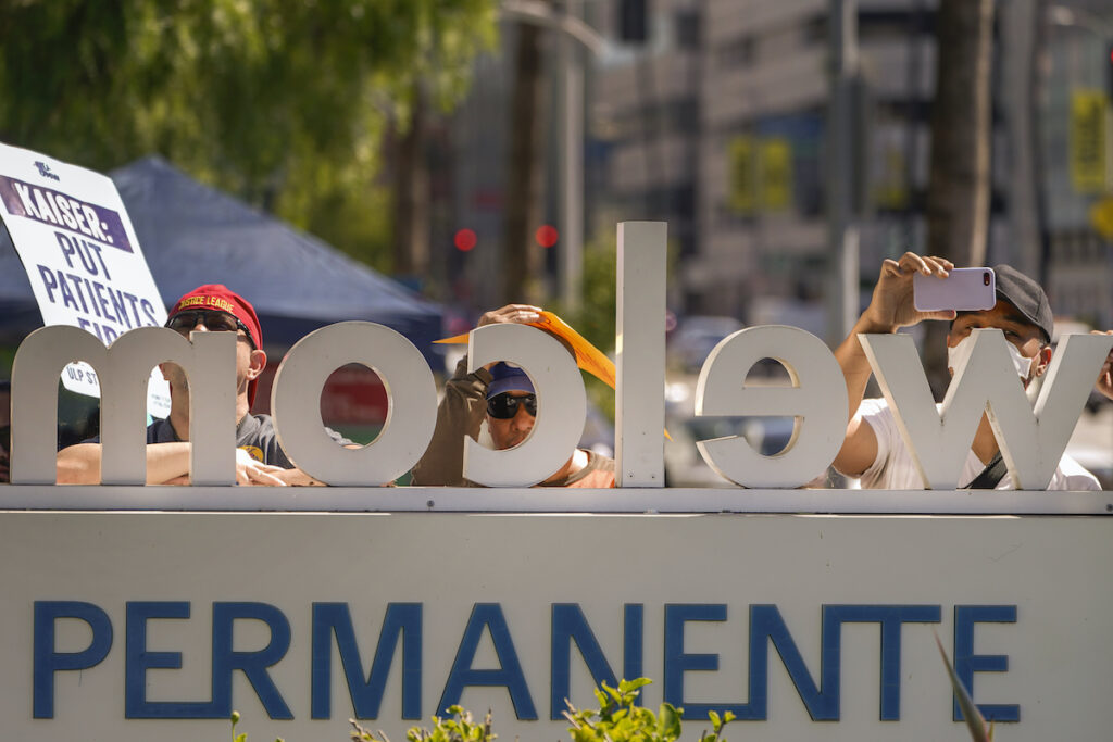 Kaiser Permanente frontline healthcare workers picket outside the Kaiser Permanente Los Angeles Medical Center in Los Angeles on Friday, Oct. 6, 2023