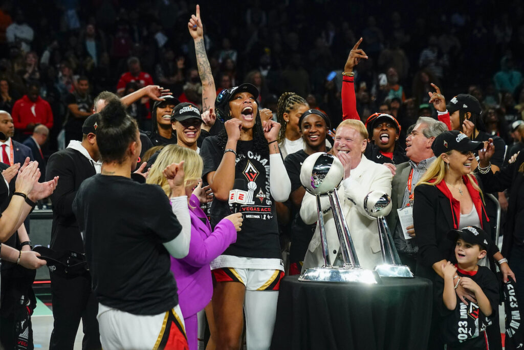Aces Liberty Basketball Las Vegas Aces' A'ja Wilson and Mark Davis celebrate with teammates next to the trophy after Game 4 of a WNBA basketball final playoff series against the New York Liberty Wednesday, Oct. 18, 2023, in New York. The Aces won 70-69. (AP Photo/Frank Franklin II)
