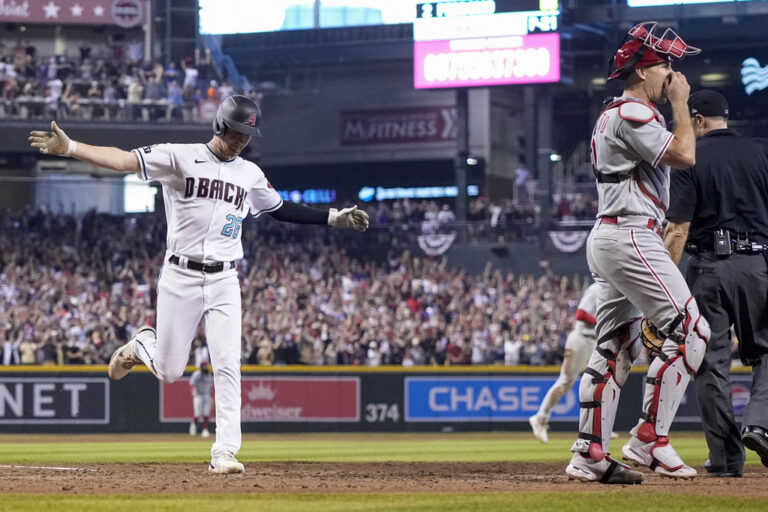 Arizona Diamondbacks' Pavin Smith celebrates after scoring the game winning run