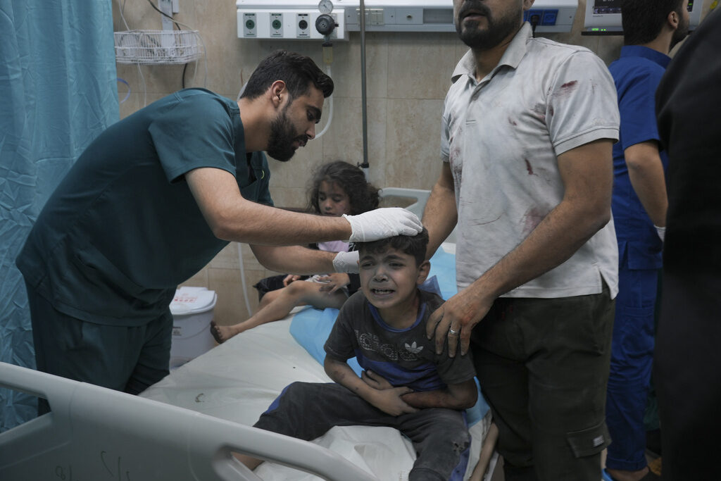 Israel Palestinians A Palestinian boy, wounded in Israeli bombardment on Gaza Strip, cries in a hospital in Deir al-Balah