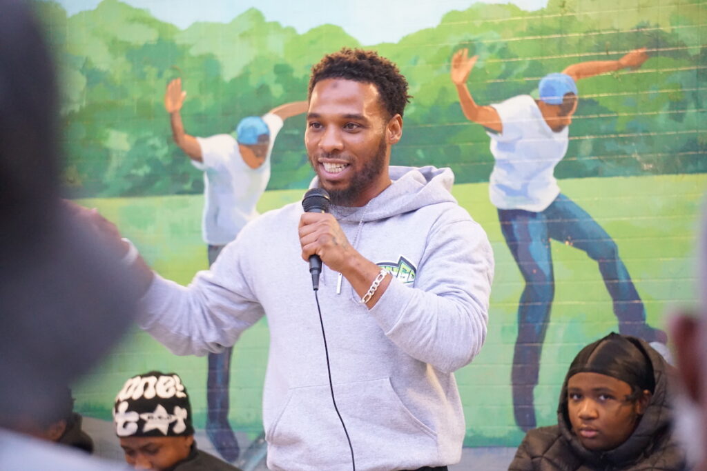 Philly-Safe-3 Tariq Moore speaks into a microphone