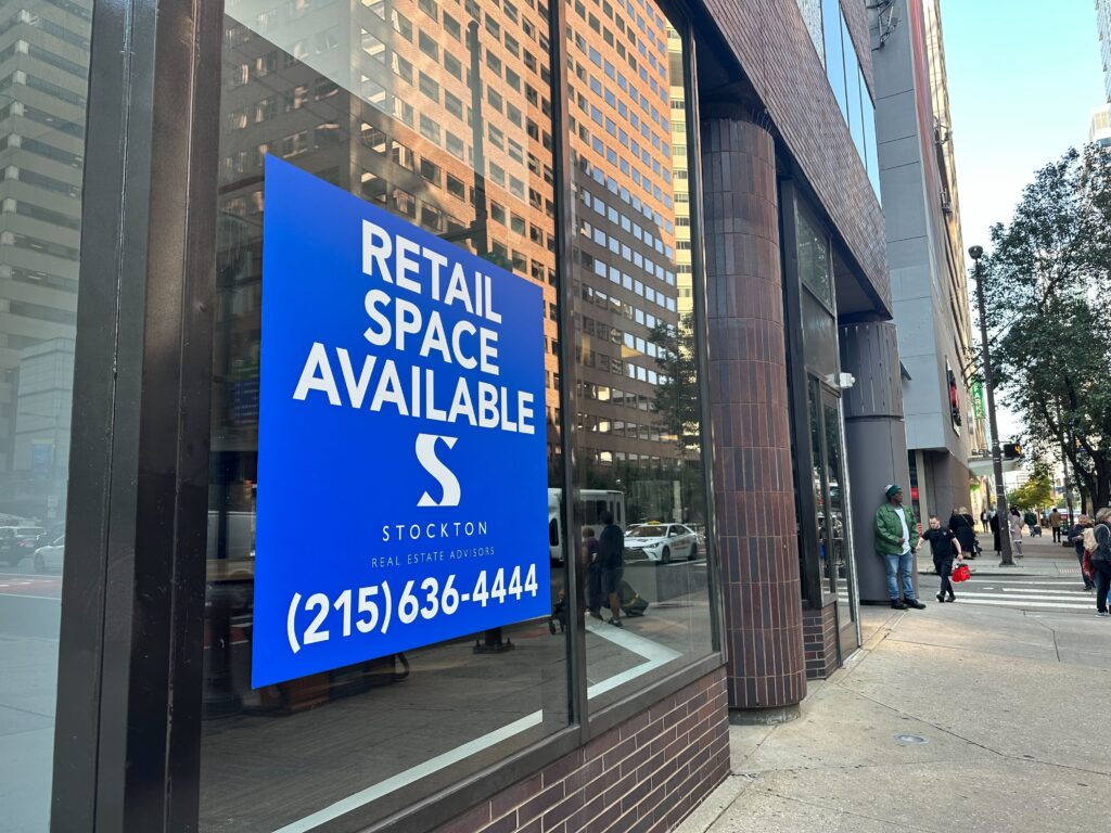 A sign in a window says 'Retail Space Available"