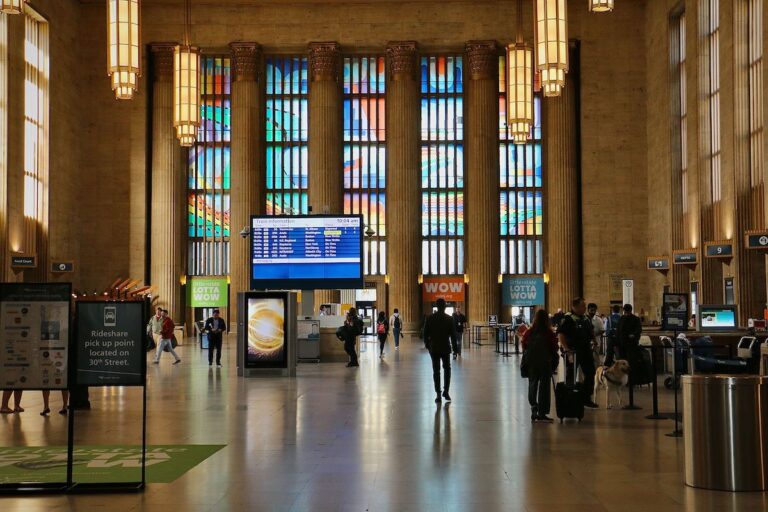 Art installation visible in windows of the train station