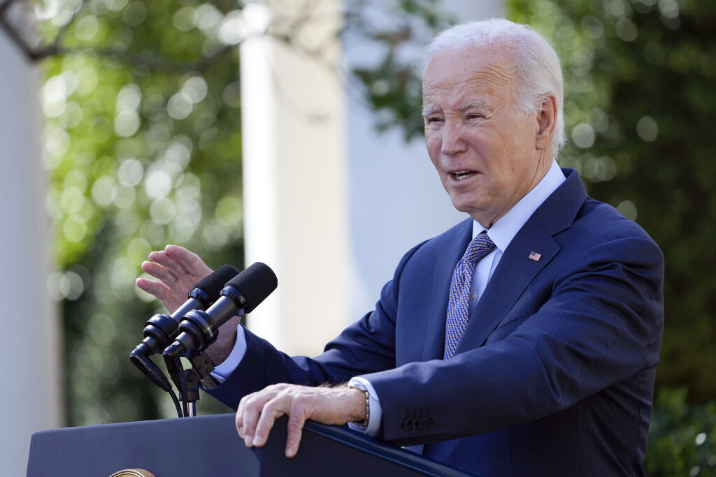 Biden Biden speaks from a podium