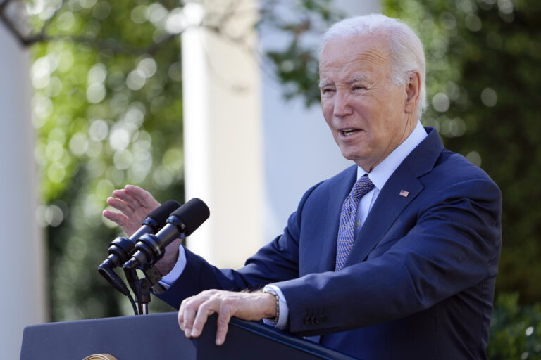 Biden speaks from a podium