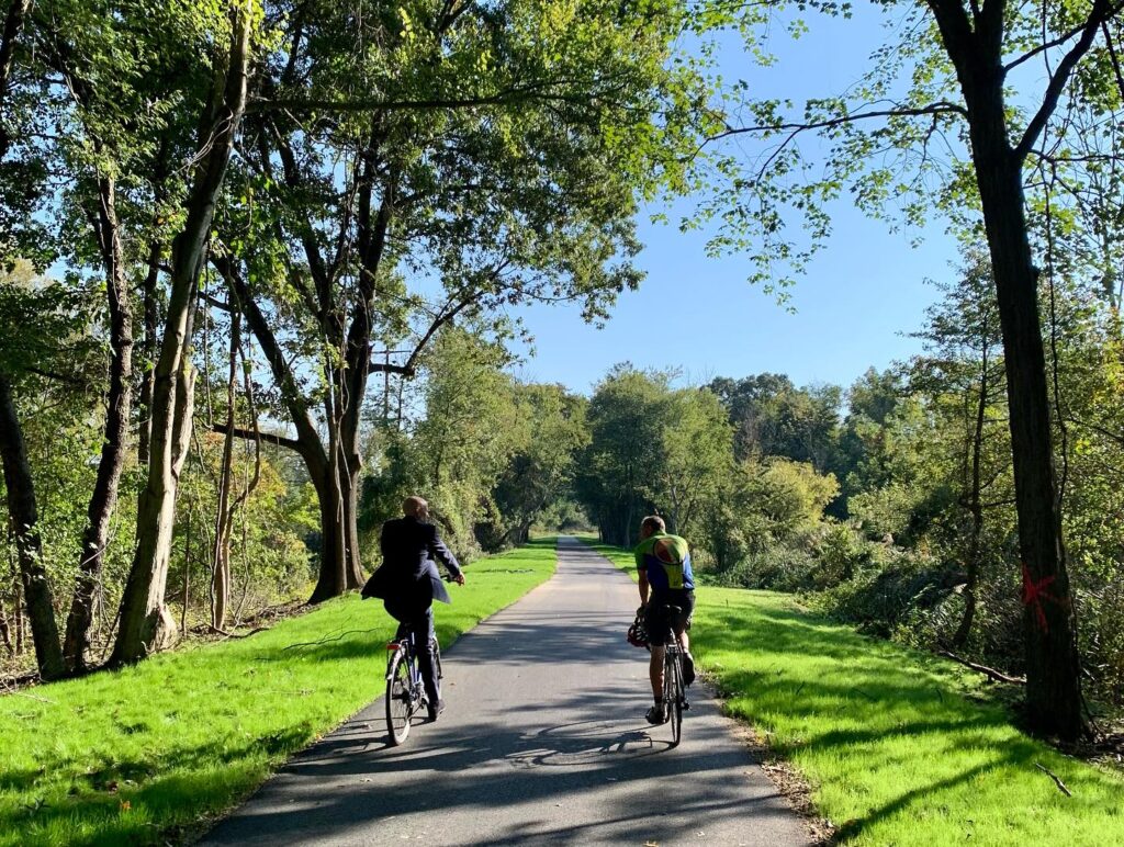 delaware-commons-blvd-pathway-bike-trail-101623 Two cyclists are seen on the Commons Boulevard Pathway Bike Trail