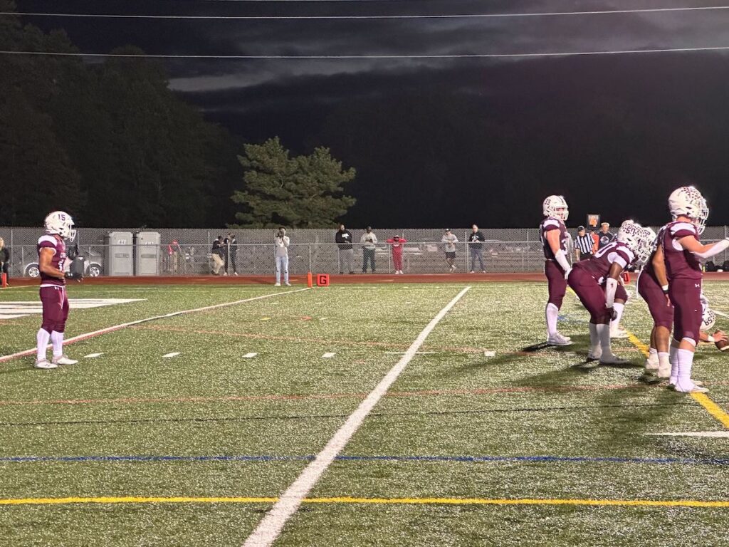 Caravels Jordan Miller readies in the backfield as offense during a football game.