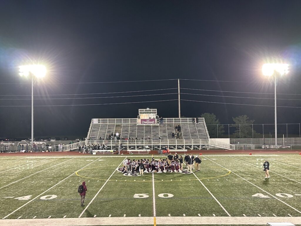 Football players on the field at Bob People's Stadium
