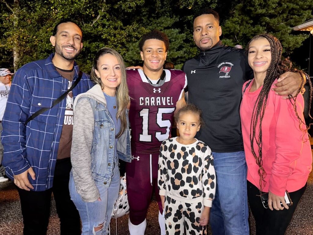 Buccaneer Jordan Miller, center, alongside his family members.