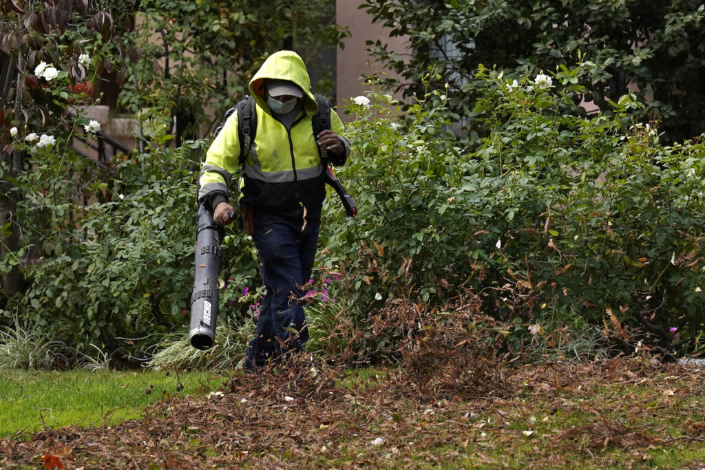 California Air Quality A gardener uses a leaf blower to clear leaves