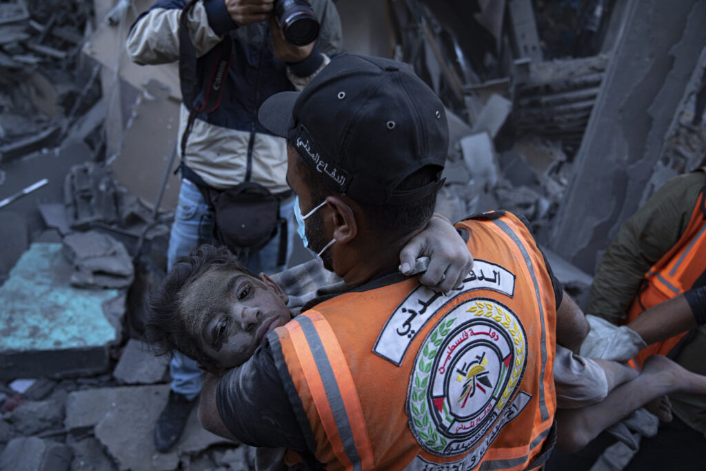 APTOPIX Palestinians Israel Palestinians evacuate wounded civilians from a building destroyed in Israeli bombardment in Khan Younis