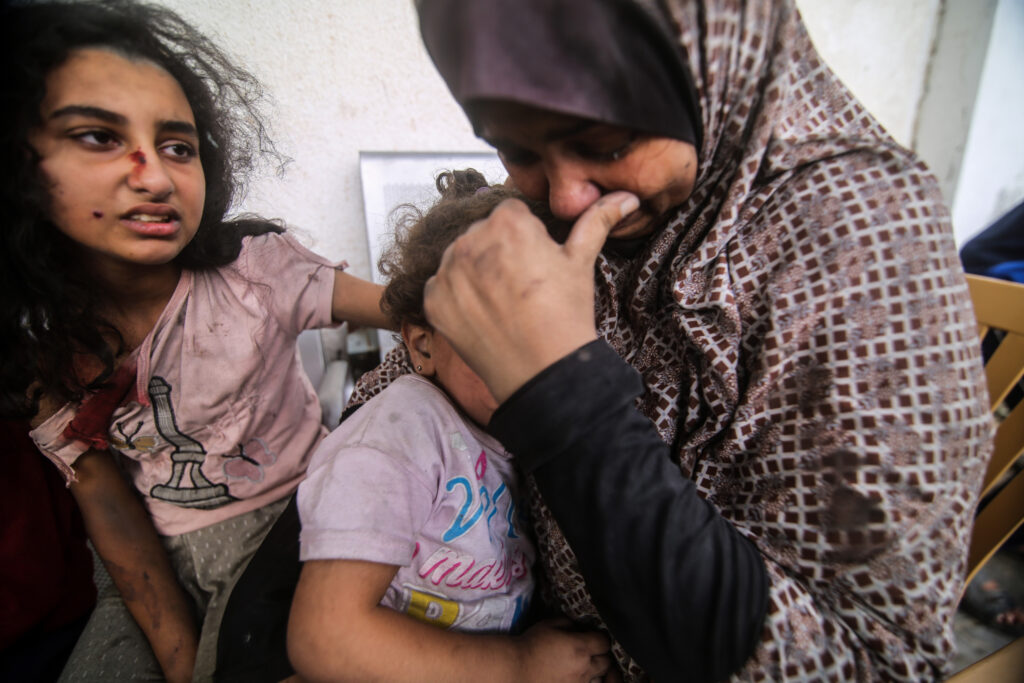 People injured from Israeli air strikes on Oct. 12 wait outside a hospital to be treated. The sheer volume of medical need is overwhelming the small and exhausted number of staff at Gaza’s medical facilities, says Dr. Mohammad Mattar, head of the radiology department at Al Shifa Hospital, the Gaza Strip’s largest medical complex. People injured from Israeli air strikes on Oct. 12 wait outside a hospital to be treated. The sheer volume of medical need is overwhelming the small and exhausted number of staff at Gaza's medical facilities, says Dr. Mohammad Mattar, head of the radiology department at Al Shifa Hospital, the Gaza Strip's largest medical complex.
