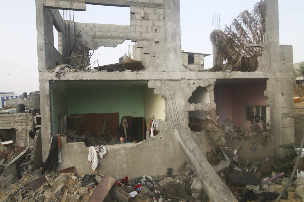 APTOPIX Israel Palestinians A building destroyed in the Israeli bombing of the Gaza Strip is seen in Rafah on Tuesday, Oct. 24, 2023.