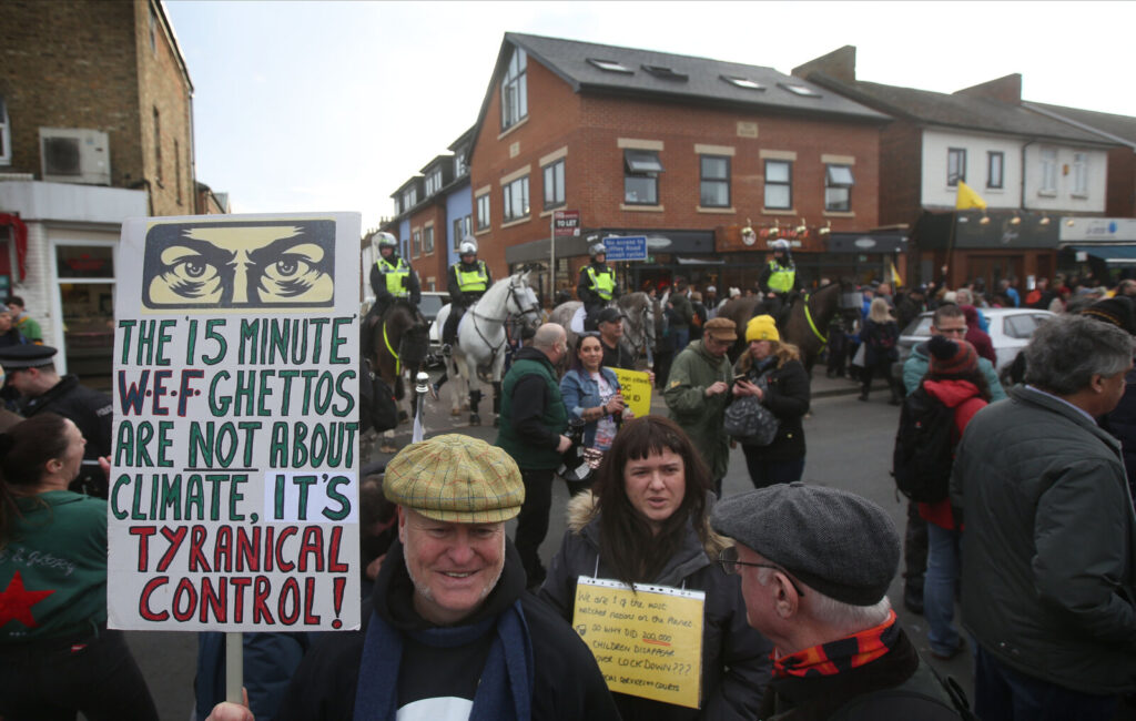 A protester demonstrates against 15-minute cities in Oxford, England, in February 2023. Fifteen-minute cities have gotten drawn into a conspiracy that global elites are trying to restrict people's movements and create open-air prisons. 
