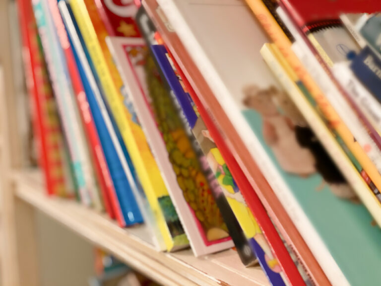 A close-up of rows of books on a shelf