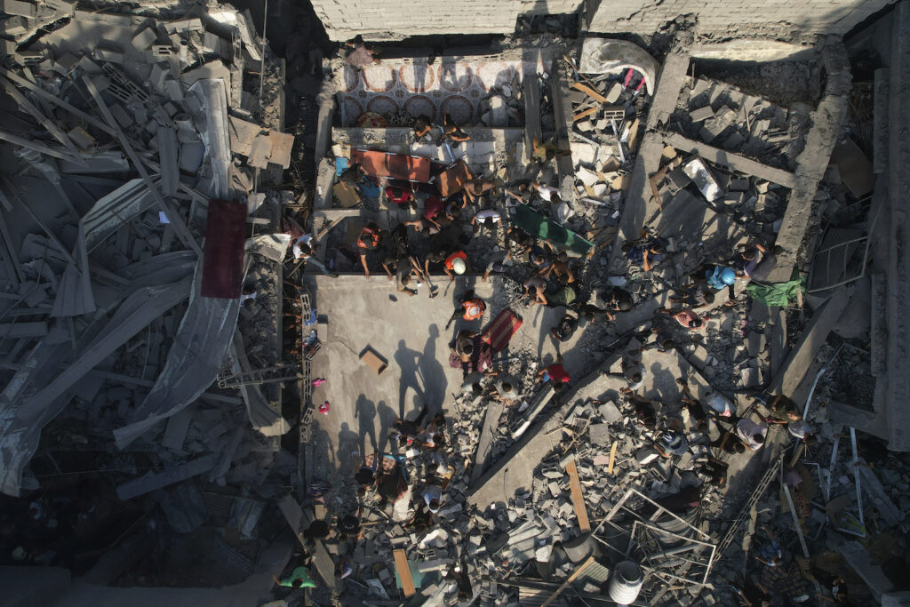 APTOPIX Israel Palestinians Palestinians inspect the rubble of buildings hit by an Israeli airstrike at Al Shati Refugee Camp