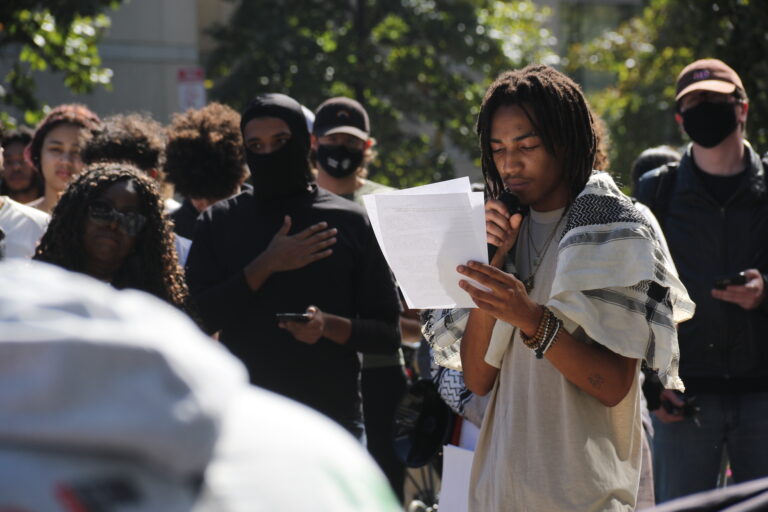 Indigo Jordan speaking into a microphone