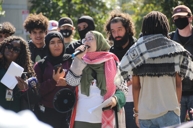 Nada speaking into a microphone