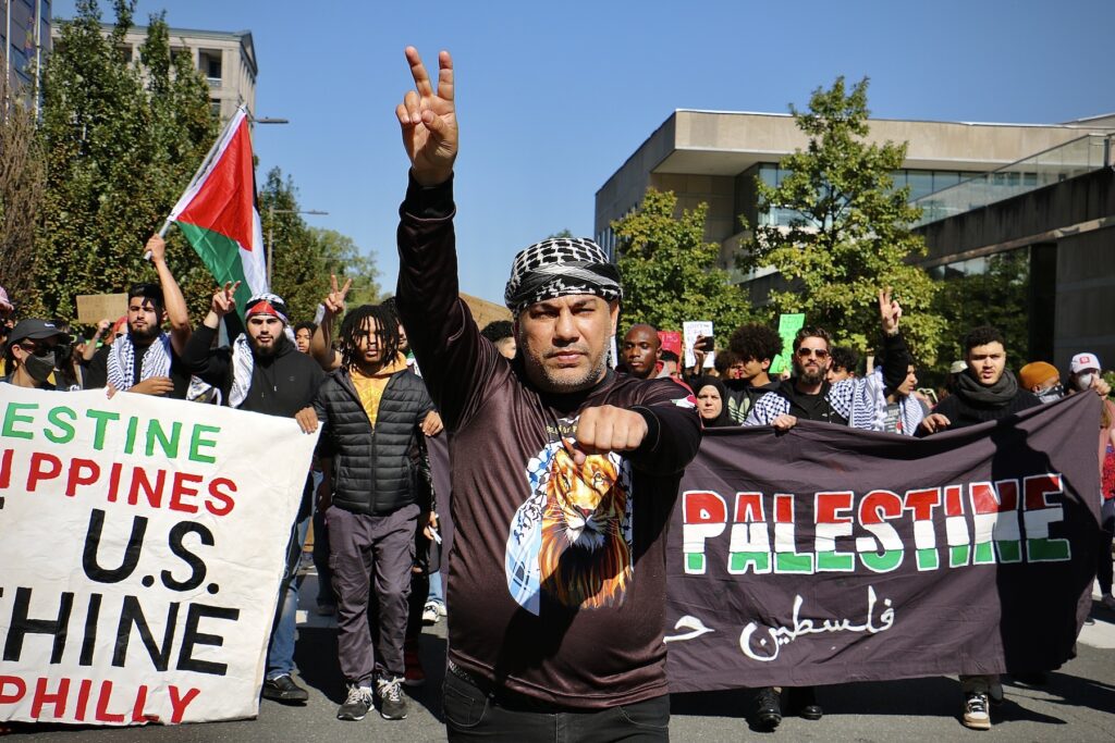 Protesters march down the street.