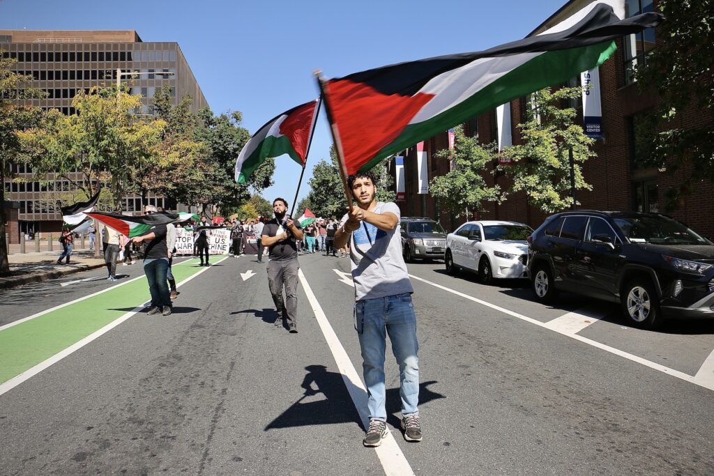 Protester waving a Palestinian flag during the march