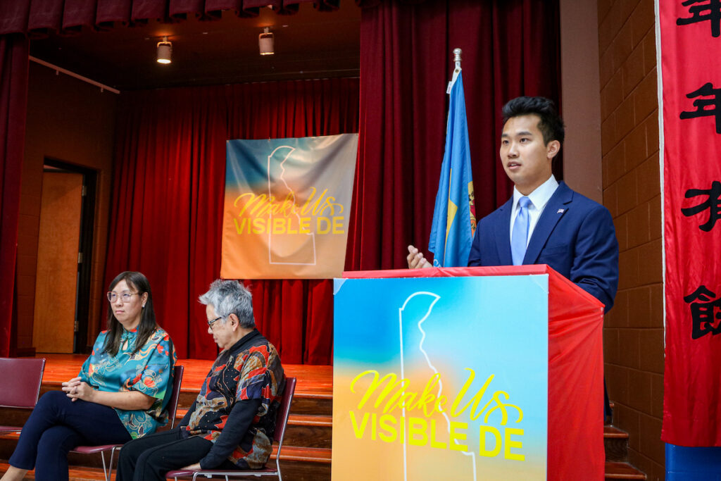 make-us-visible-1 Devin Jiang speaks at a podium.