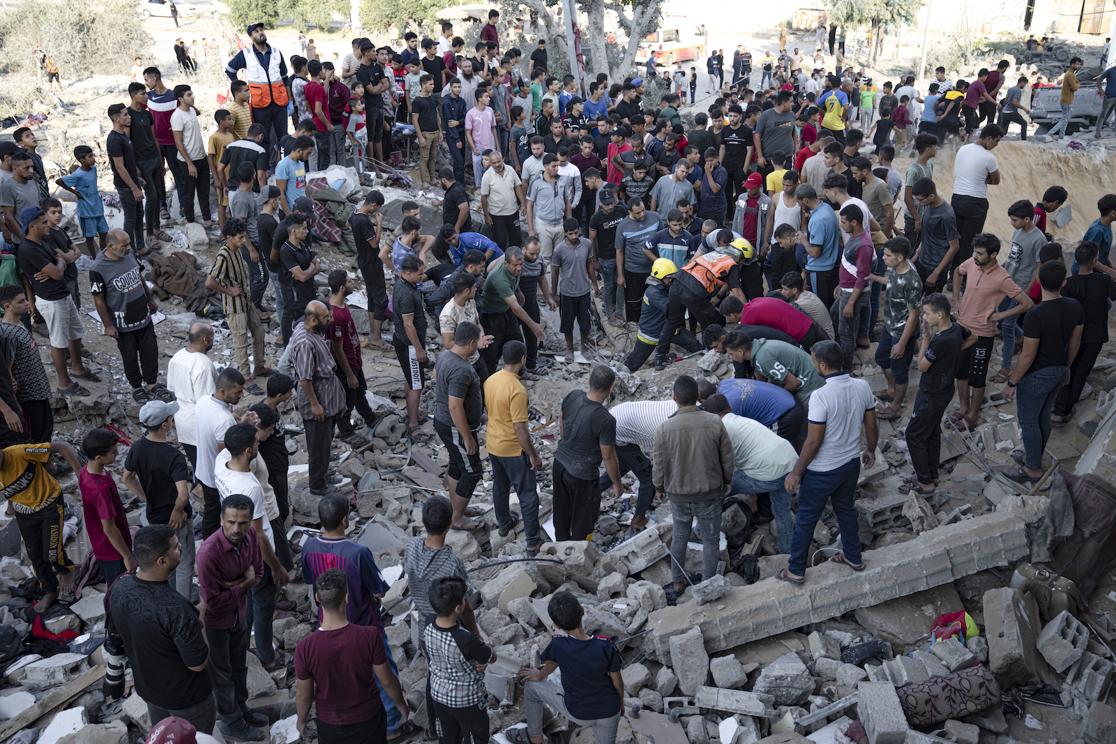 Israel Palestinians Palestinians look fro survivors after Israeli airstrikes in Khan Younis, Gaza Strip