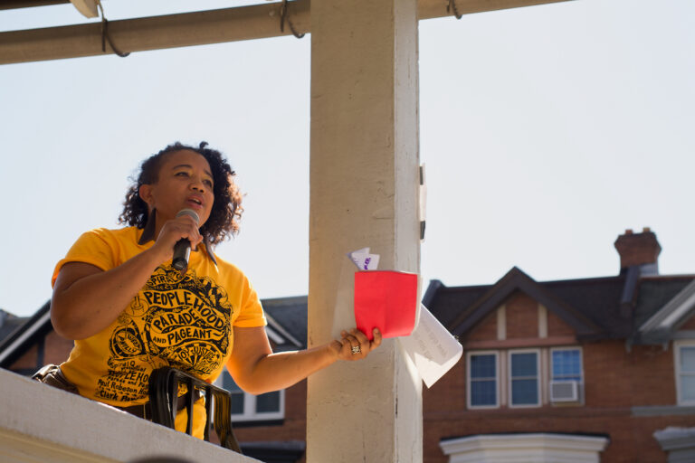 Jennifer Turnbull speaks into a microphone.