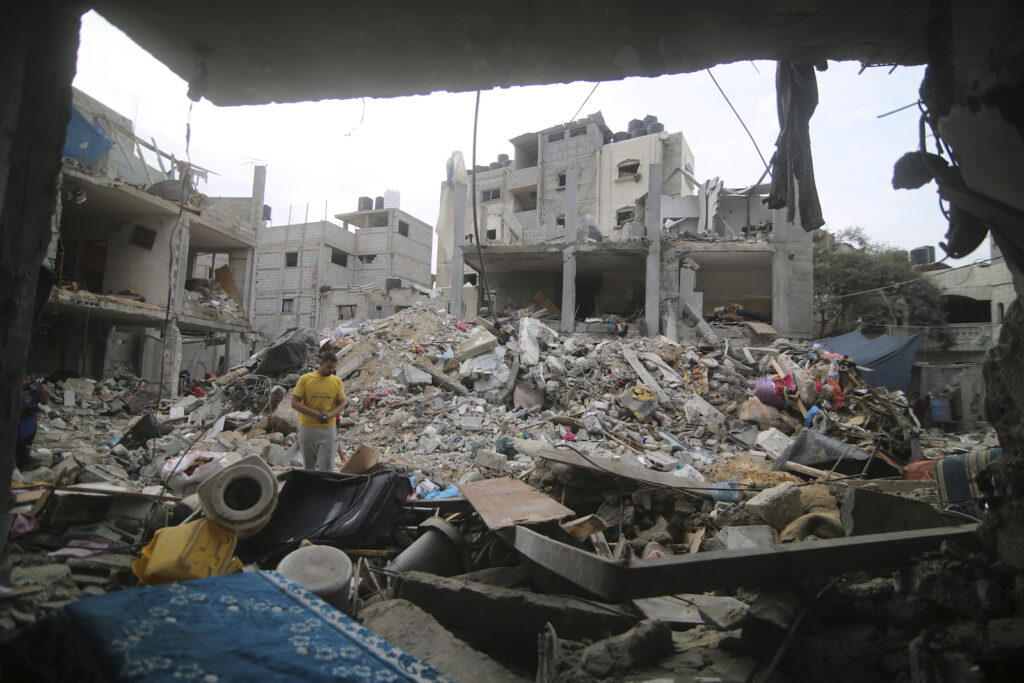 Israel Palestinians Palestinians inspect the rubble in Rafah refugee camp, Gaza Strip