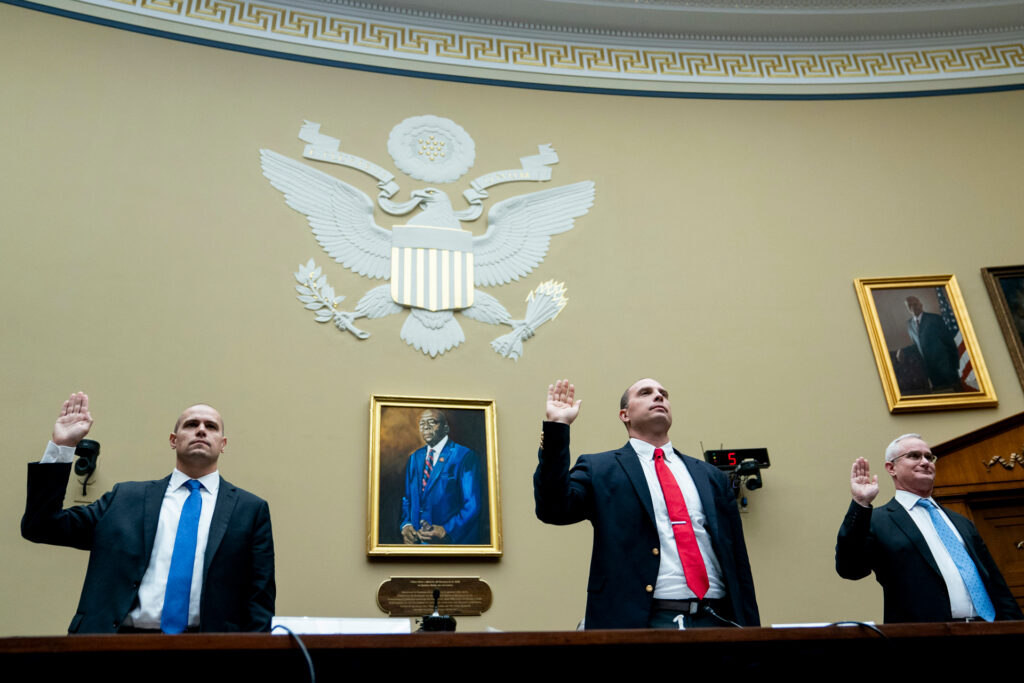the-pulse Ryan Graves, Americans for Safe Aerospace Executive Director, from left, U.S. Air Force (Ret.) Maj. David Grusch, and U.S. Navy (Ret.) Cmdr. David Fravor, are sworn in during a House Oversight and Accountability subcommittee hearing on UFOs, Wednesday, July 26, 2023, on Capitol Hill in Washington. (AP Photo/Nathan Howard)