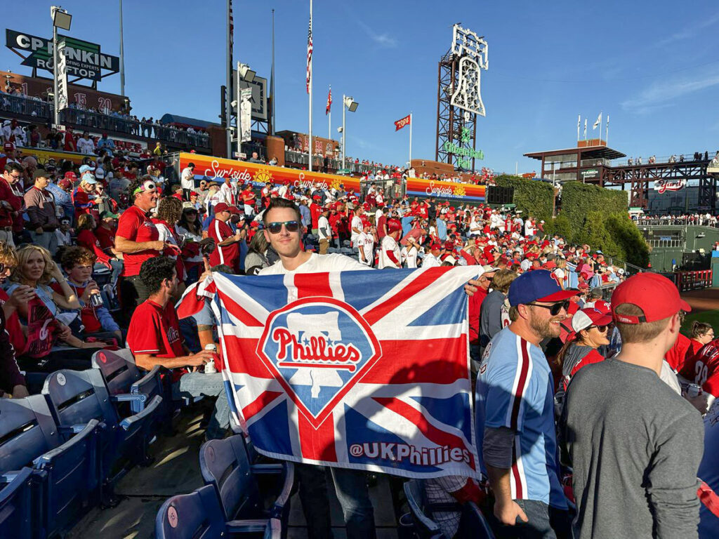 ukphillies-daveshaw-4 Dave Shaw holding his UK Phillies Union Jack at Game 3 of the NLDS at Citizens Bank Park on Oct. 11.