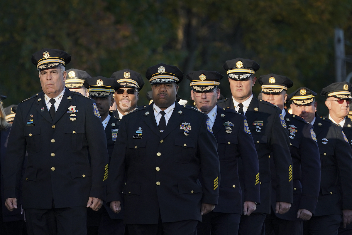 The command staff of the Philadelphia Police Department marches to the viewing for slain Police Officer Richard Mendez, Monday Oct. 23, 2023, in Northeast Philadelphia.