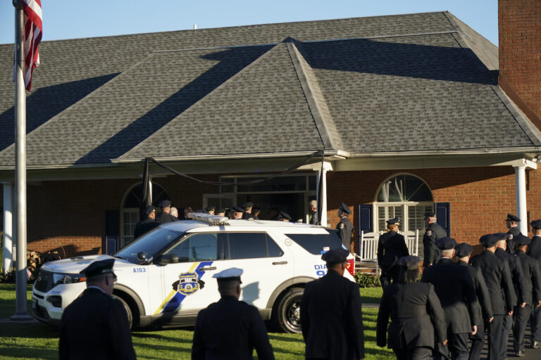 Members of the Philadelphia Police Department enter the viewing for slain Police Officer Richard Mendez, Monday Oct. 23, 2023, in Northeast Philadelphia.