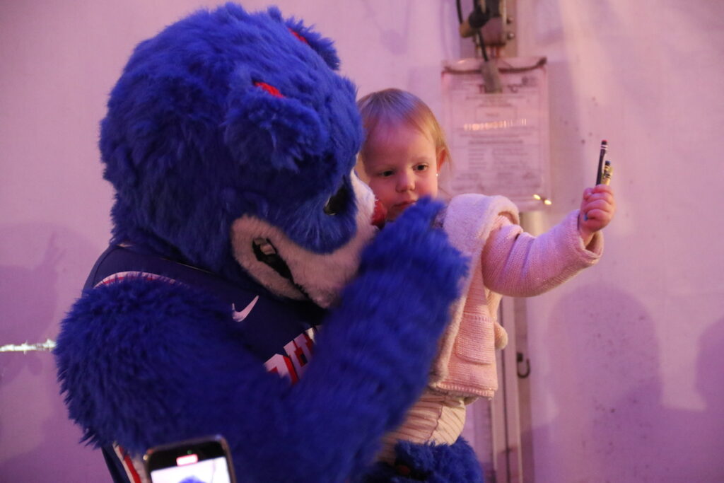 The Philadelphia 76ers and Toyota served a Thanksgiving dinner to military service members and veterans onboard the Battleship New Jersey on Monday night in Camden, New Jersey. (Cory Sharber/WHYY)