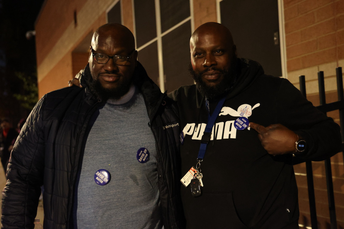 North Philadelphia residents Lamont T. Coley (left) and Raymond Brown (right) outside of a polling station