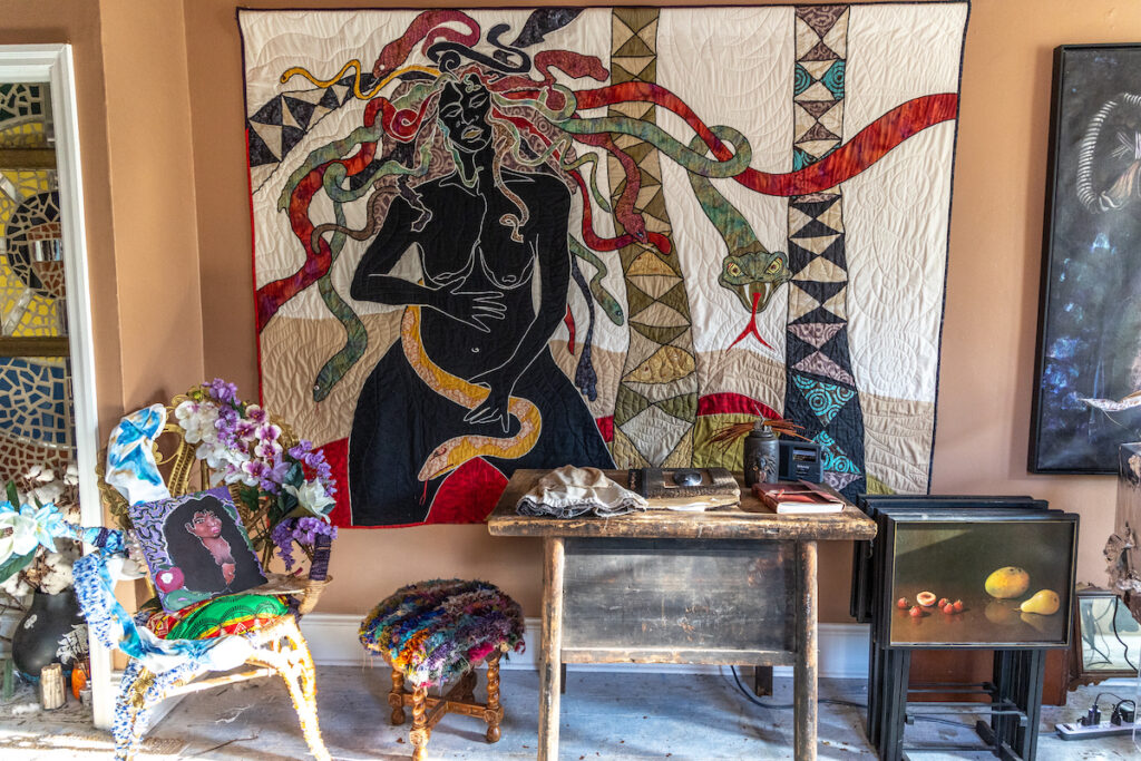 Medusa quilt and throw pillow by Ellen Blalock in the Afrofuturism room
