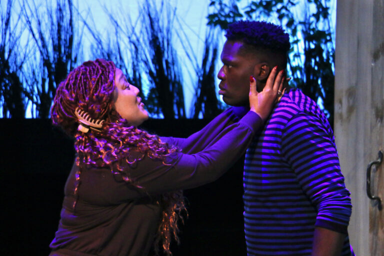 Tedra (Donnie Hammond) tries to calm the madness of her son, Juicy (Brenson Thomas) during a rehearsal