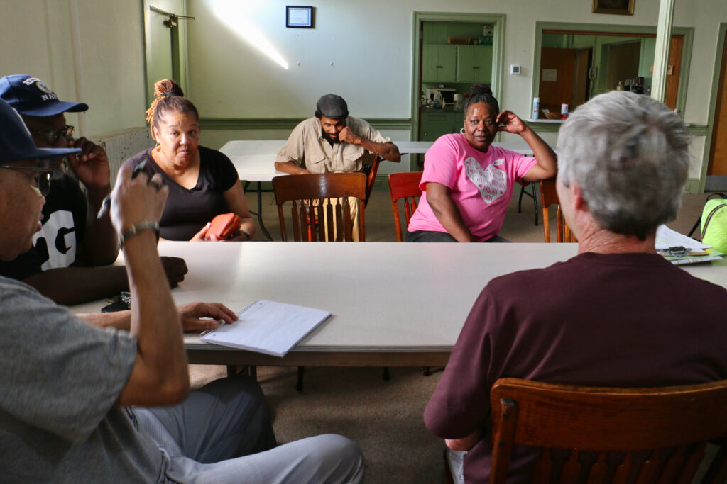 A group of people seated in a room.