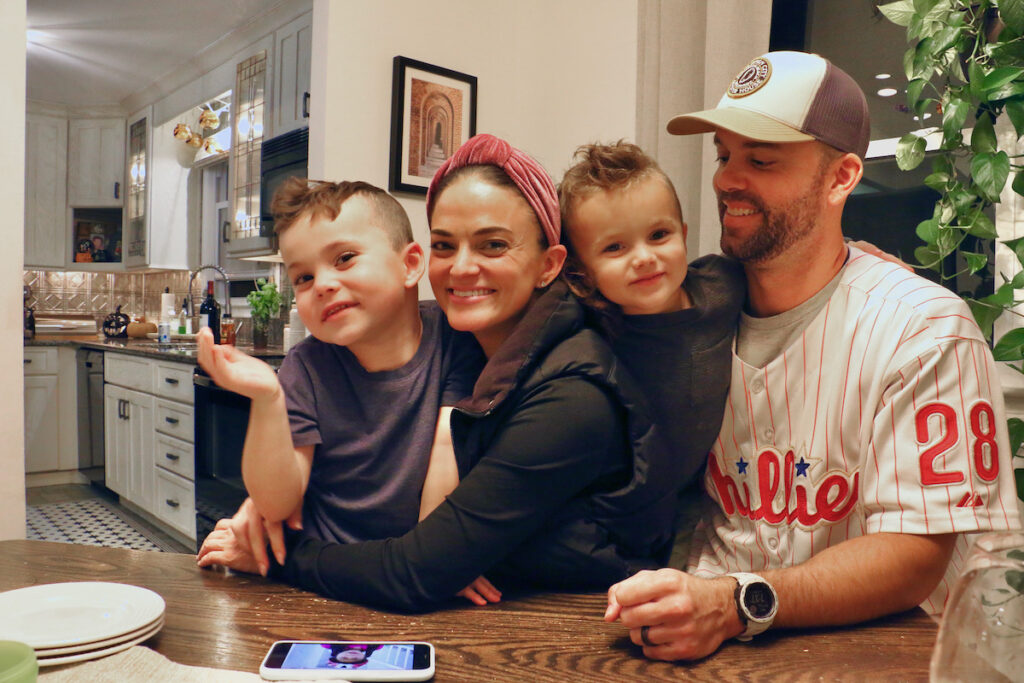 The Huber family (from left), Cash, Jena Stone, and Phil, and big sister Ava (not pictured) at home in Wilmington. (Emma Lee/WHYY)