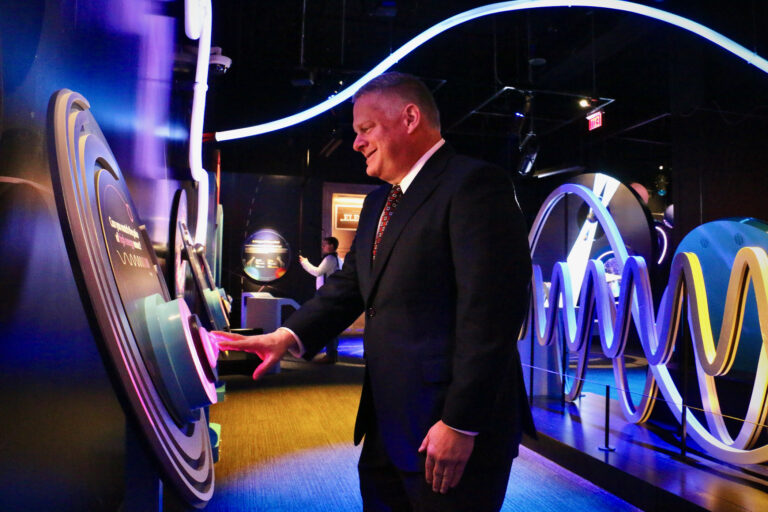 Franklin Institute President CEO Larry Dubinski interacts with an exhibit.