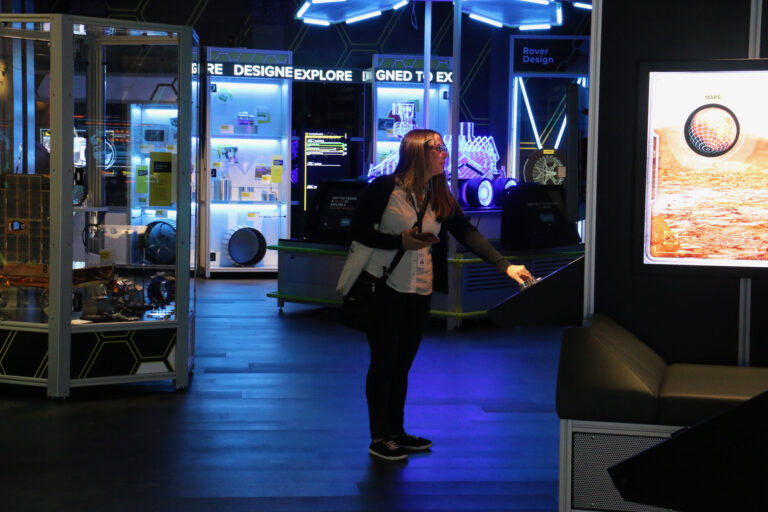 A person interacts with an exhibit