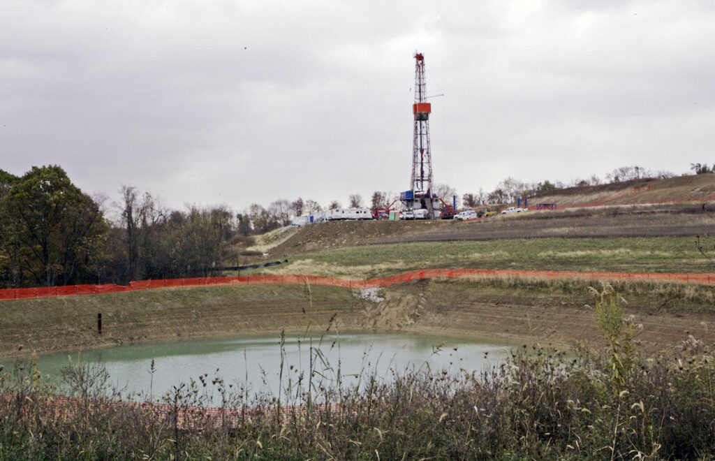 Gas Drilling-Pennsylvania In this Oct. 29, 2008, file photo, a drilling rig used to extract natural gas from the Marcellus Shale, located on a hill above a pond on John Dunn's farm in the Washington County borough of Houston, Pa.