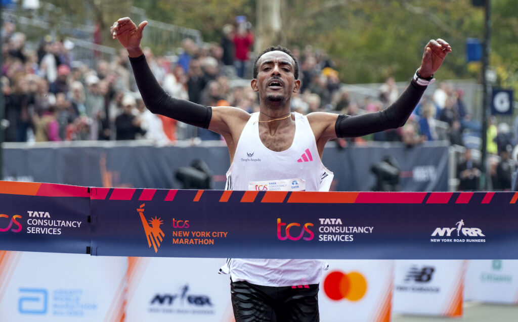 Tamirat Tola, of Ethiopia, crosses the finish line in the professional men's division of the New York City Marathon, Sunday, Nov. 5, 2023, in New York. (