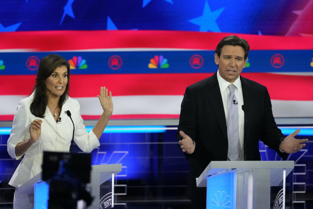 Election 2024 Debate Republican presidential candidates former U.N. Ambassador Nikki Haley and Florida Gov. Ron DeSantis talk during a Republican presidential primary debate hosted by NBC News, Wednesday, Nov. 8, 2023, at the Adrienne Arsht Center for the Performing Arts of Miami-Dade County in Miami.