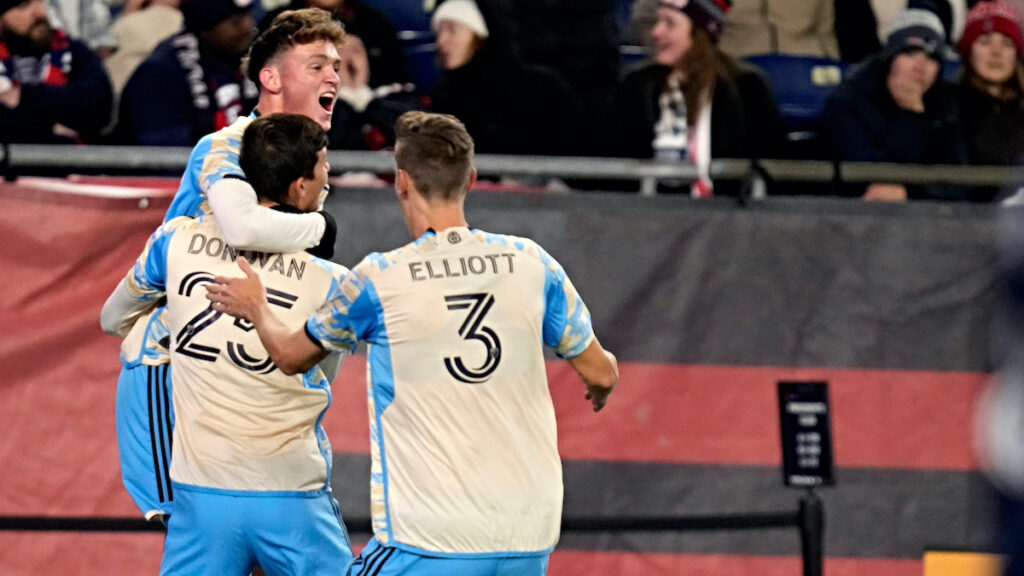 Philadelphia Union forward Chris Donovan (25) is congratulated after his goal against the New England Revolution during the second half of an MLS playoff soccer game, Wednesday, Oct. 8, 2023, in Foxborough, Mass.