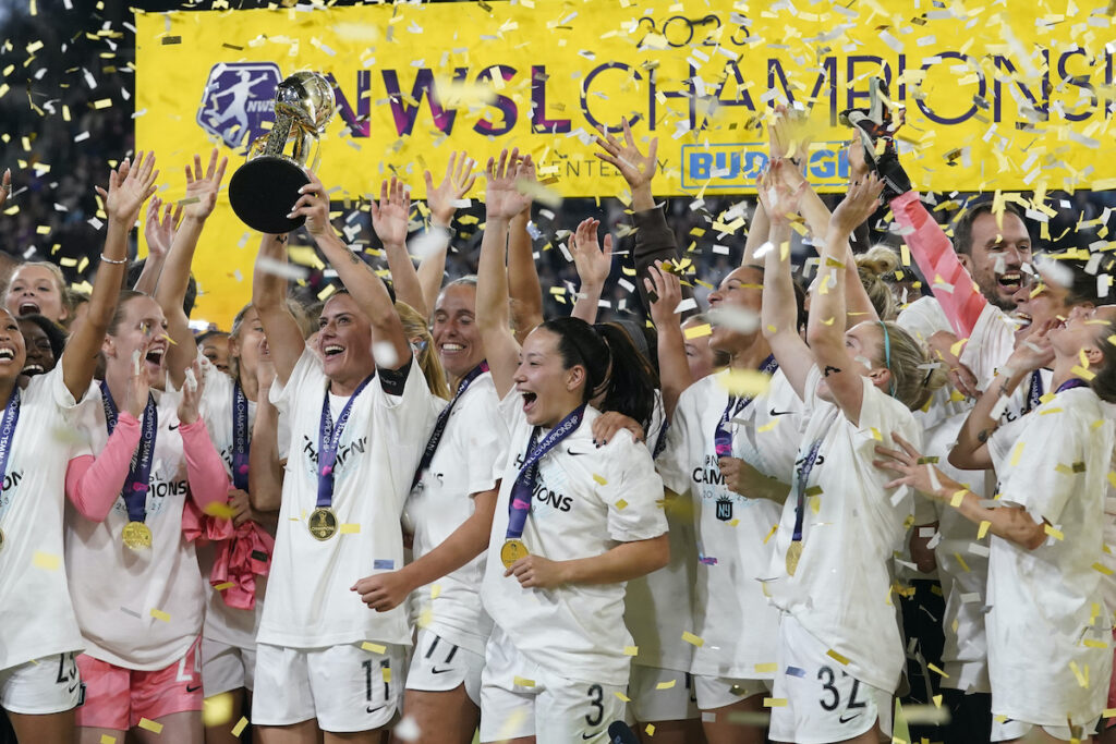 NWSL Championship Soccer NJ/NY Gotham defender Ali Krieger holds the trophy after NJ/NY Gotham defeated OL Reign 2-1 in the NWSL Championship soccer game, Saturday, Nov. 11, 2023, in San Diego.