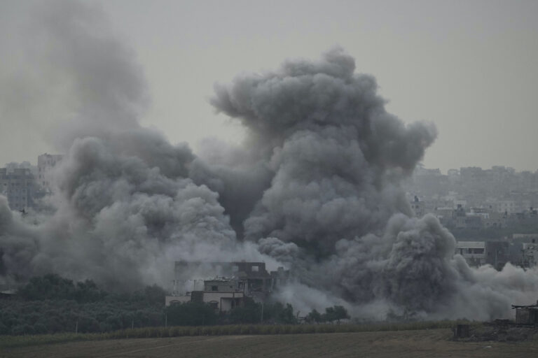 FILE - Smoke rises following an Israeli airstrike in the Gaza Strip, as seen from southern Israel on Nov. 12, 2023. As the military sets its sights on southern Gaza in its campaign to stamp out Hamas, key challenges loom. International patience for a protracted invasion has begun to wear thin. And with some 2 million displaced Gaza residents staying in crowded shelters in the south in dire conditions, a broad military offensive there could unleash a new humanitarian disaster during the cold, wet winter.(AP Photo/Leo Correa, File)